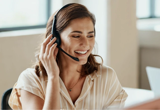 Smiling woman wearing a headset – online psychiatry in Long Beach, CA